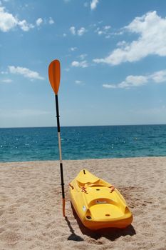 kayak and paddle on a sandy beach