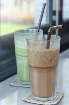 ice coffee and milk green tea  in glass on table