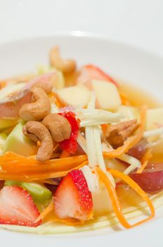 close up spicy  mix  fruits salad with chili sauce