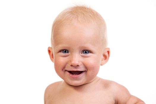 Portrait of a smiling nine-month old boy over white background