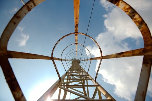 Rusty steel ladder pointing to the sky