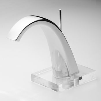 Brand new water tap on bright background