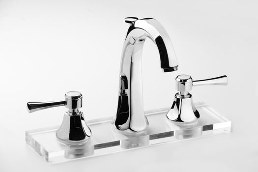 Brand new water tap on bright background