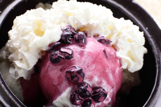 cold and white icecream in black pan