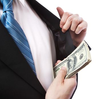 Business Man putting a wad of cash in his suit jacket pocket on white background