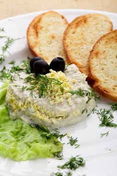 salad with roasted bread in white dish