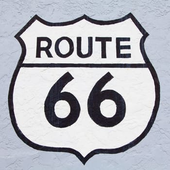 Famous streetsight of Route 66 painted on a wall in Flagstaff