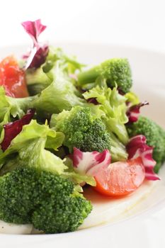 fresh and tasty salad on white background