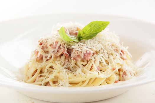 hot and tasty pasta with meat on white dish