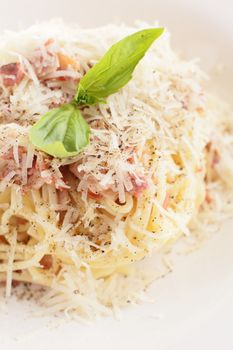 hot and tasty pasta with meat on white dish