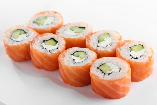 fresh and tasty sushi on bright background