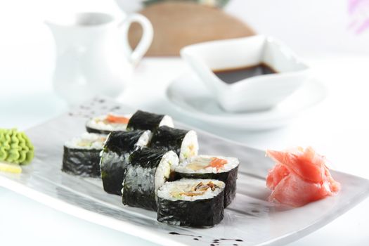 fresh and tasty sushi on bright background