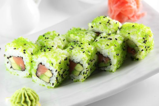 fresh and tasty sushi on bright background