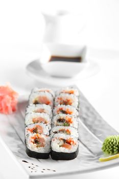 fresh and tasty sushi on bright background