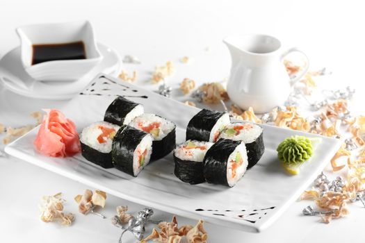 fresh and tasty sushi on bright background