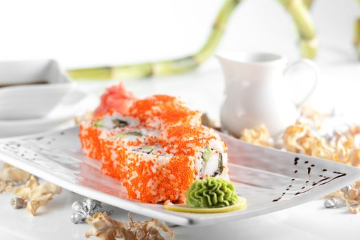 fresh and tasty sushi on bright background