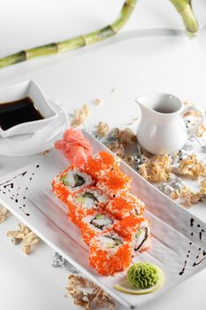 fresh and tasty sushi on bright background