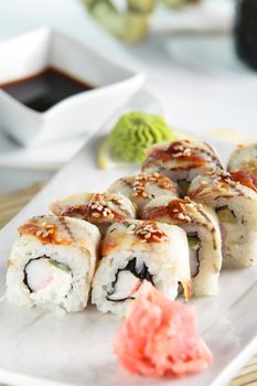 fresh and tasty sushi on bright background