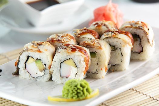 fresh and tasty sushi on bright background