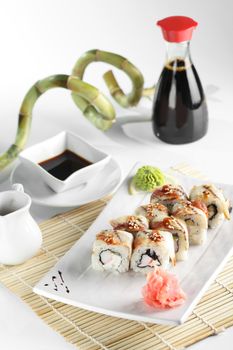 fresh and tasty sushi on bright background