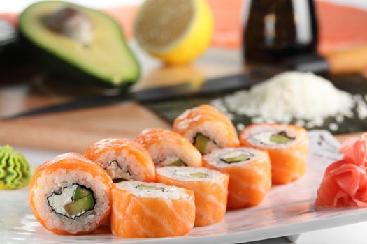 fresh and tasty sushi on bright background