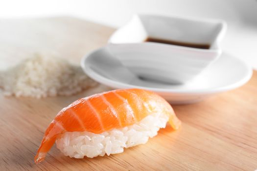 fresh and tasty sushi on bright background