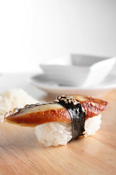 fresh and tasty sushi on bright background