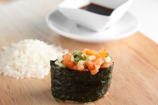 fresh and tasty sushi on bright background