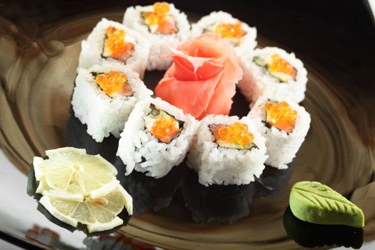 cold sushi on black dish and white background