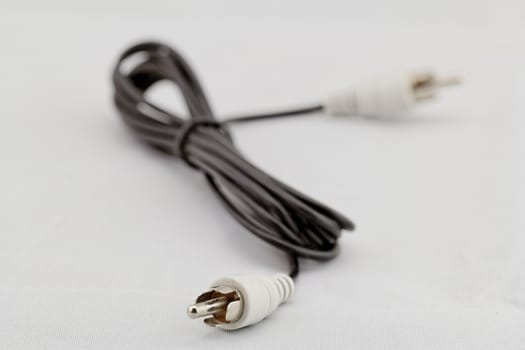 only white audio RCA cable on a white background (right)