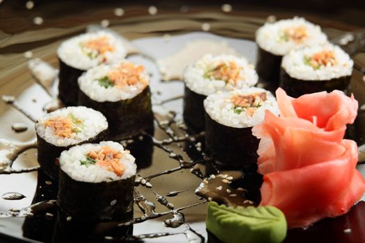 cold sushi on black dish and white background