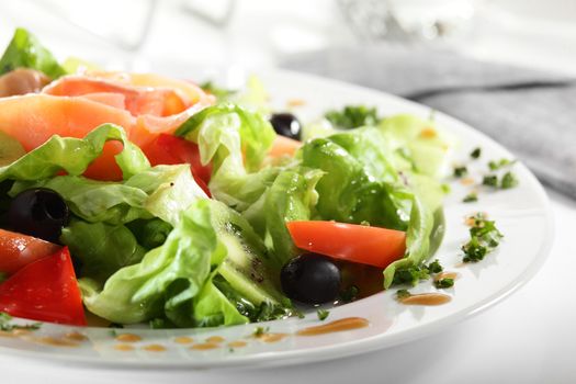 fresh and tasty european salad on white dish