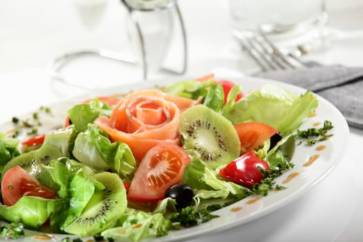 fresh and tasty european salad on white dish