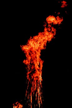 red flames of huge bonfire or campfire as black backgorund