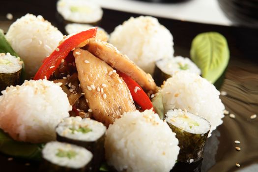 cold sushi on black dish and white background