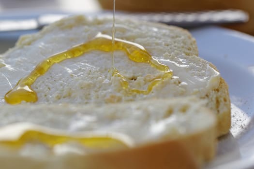 bread with honey and butter as breakfast