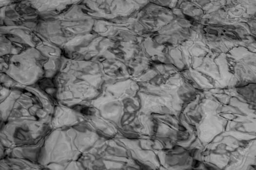 grey abstract background of wavy water surface