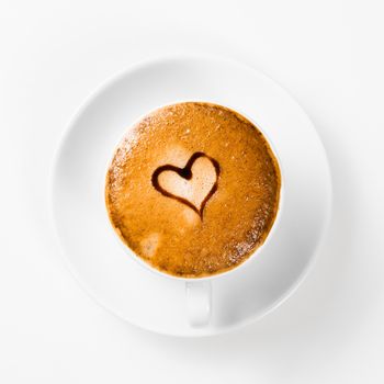 large cup of coffee with heart pattern on the foam