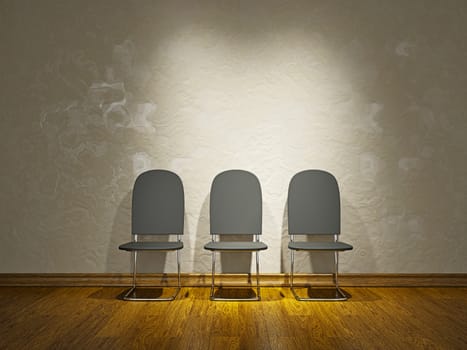 Three leather chairs near a cement wall