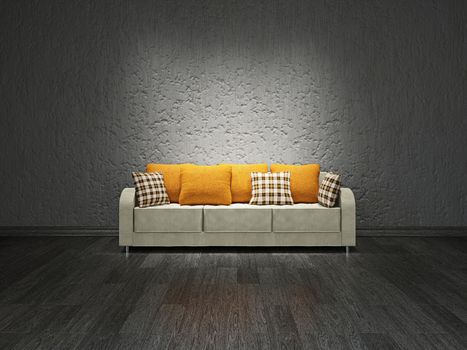 Sofa with pillows near the concrete wall