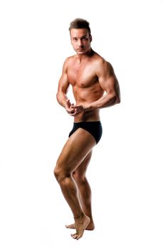 Handsome athletic young man in classic bodybuilder pose, isolated on white