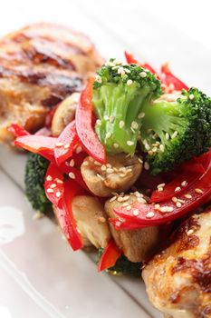 hot roasted chicken with pepper on white background