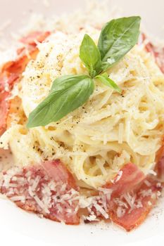 hot and tasty pasta with cheese on white background