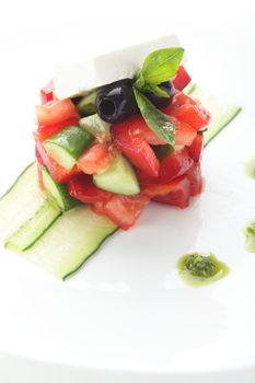 fresh salad with pepper and olives on white background