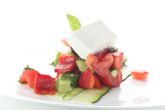 fresh salad with pepper and olives on white background