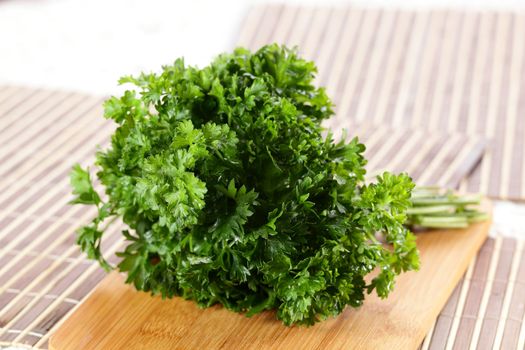 fresh tasty and wet salad on wooden background