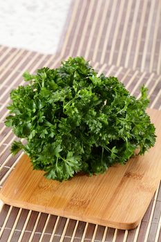 fresh tasty and wet salad on wooden background