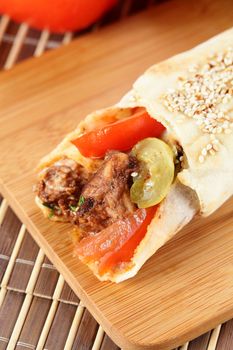 hot fresh and tasty shawarma with vegetables on wooden background