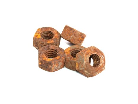 Rusty nuts on a white background.