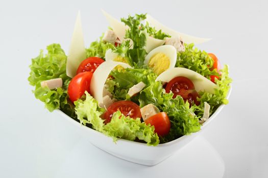 fresh and tasty salad on white background